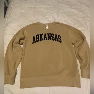 Women’s Small Arkansas Sweatshirt. Tan with black sewn on letters.
